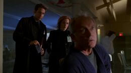 Frank Black is visited by Fox Mulder and Dana Scully