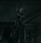 Dobby lostening the chandelier