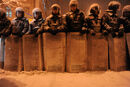 A line of riot police officers under thr heavy snow fall in Kiev, as the city prepares for the predictably violent attack from the police. December 9, 2013.jpg