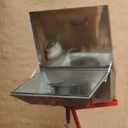 Through the wall solar cooker