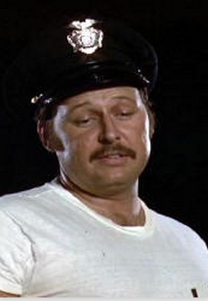 Patrick Wricht as cop in 1979 film &quot;Roller Boogie&quot;. - Patrick_Wright_cop_Roller_Boogie